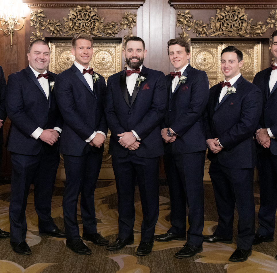 Photo of the men's that are wearing tuxedo