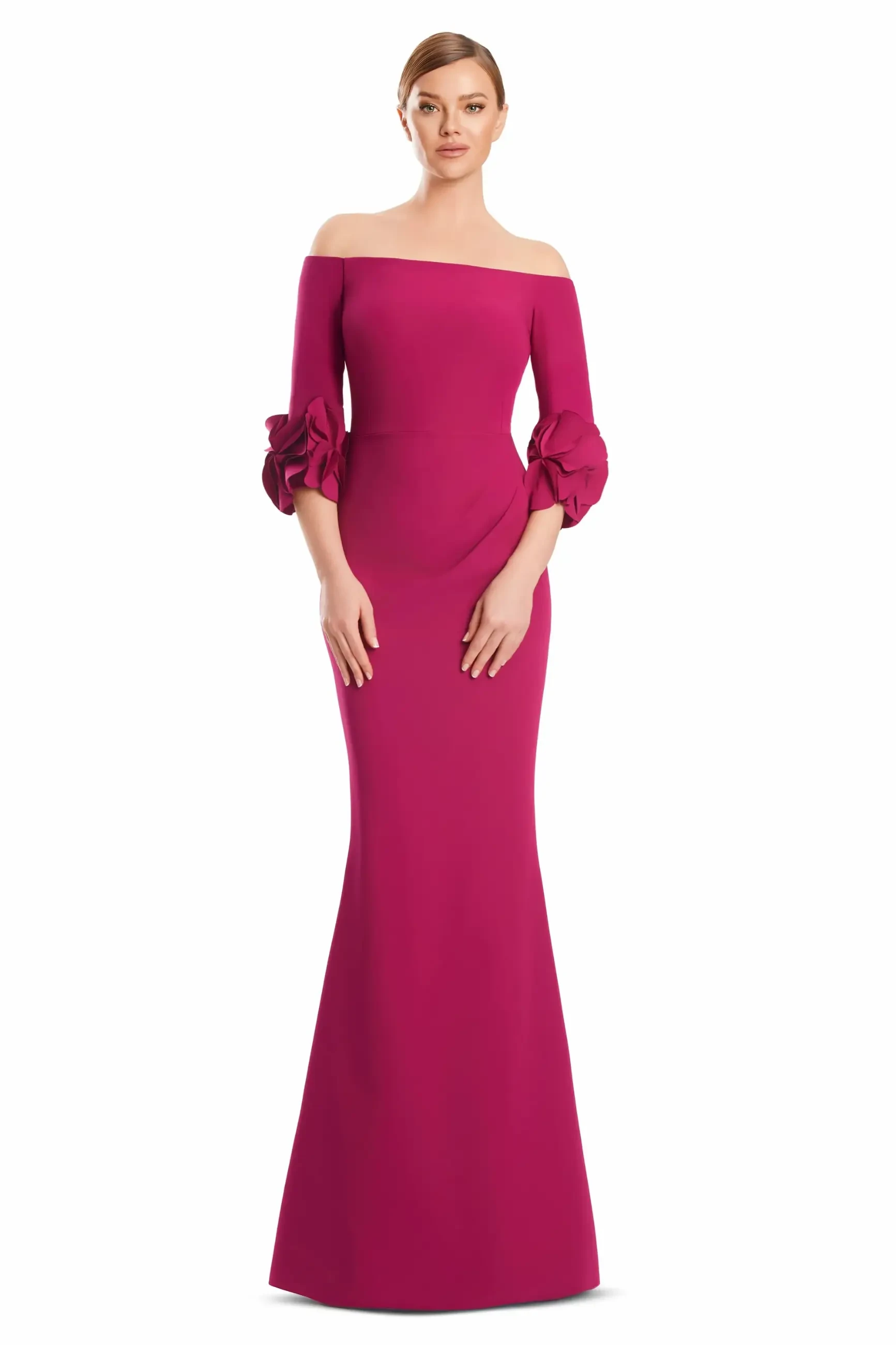 A model wearing a long, fitted magenta dress with off-the-shoulder sleeves that have ruffled details.