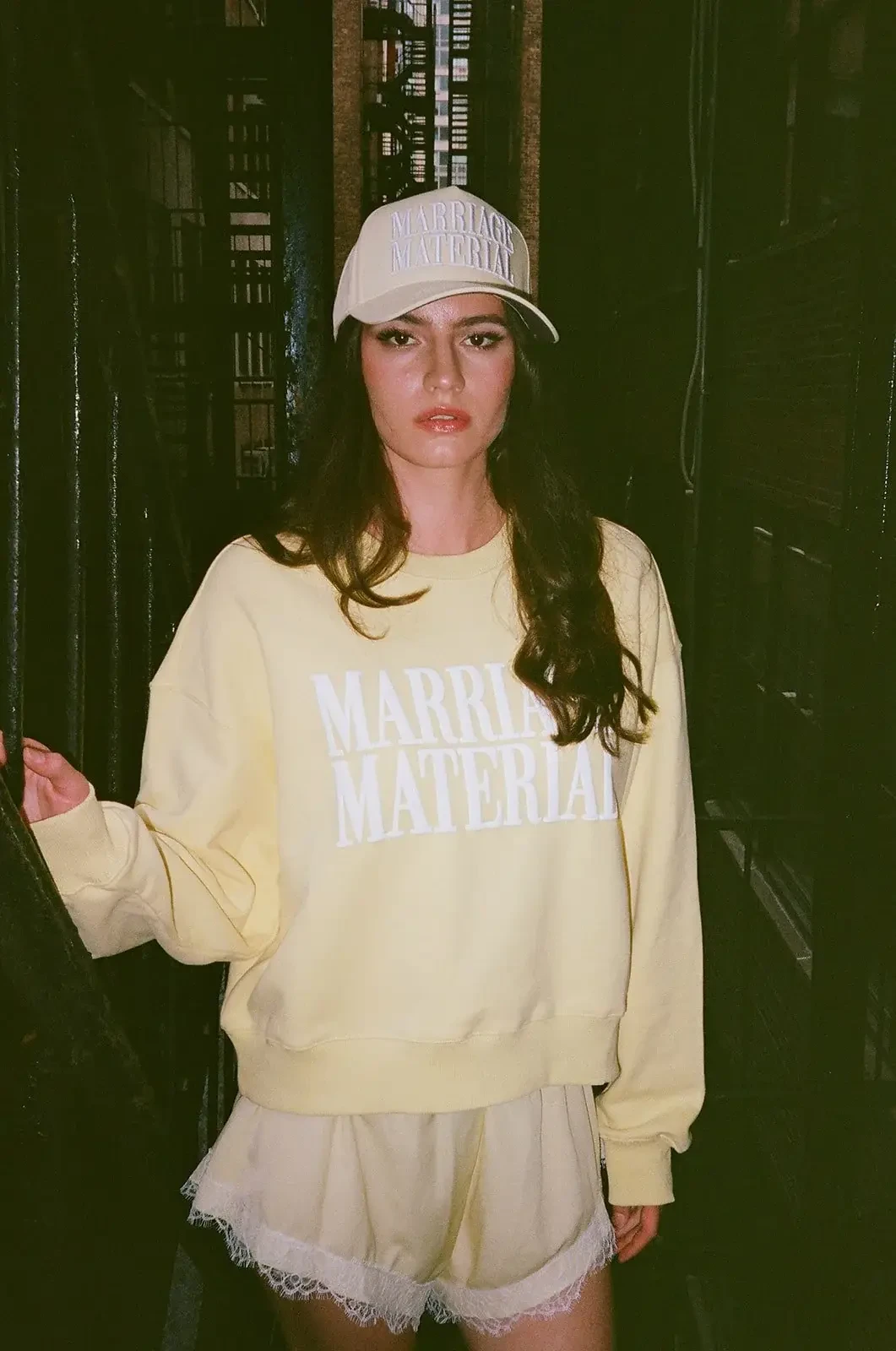 model is wearing a yellow marriage material sweatshirt