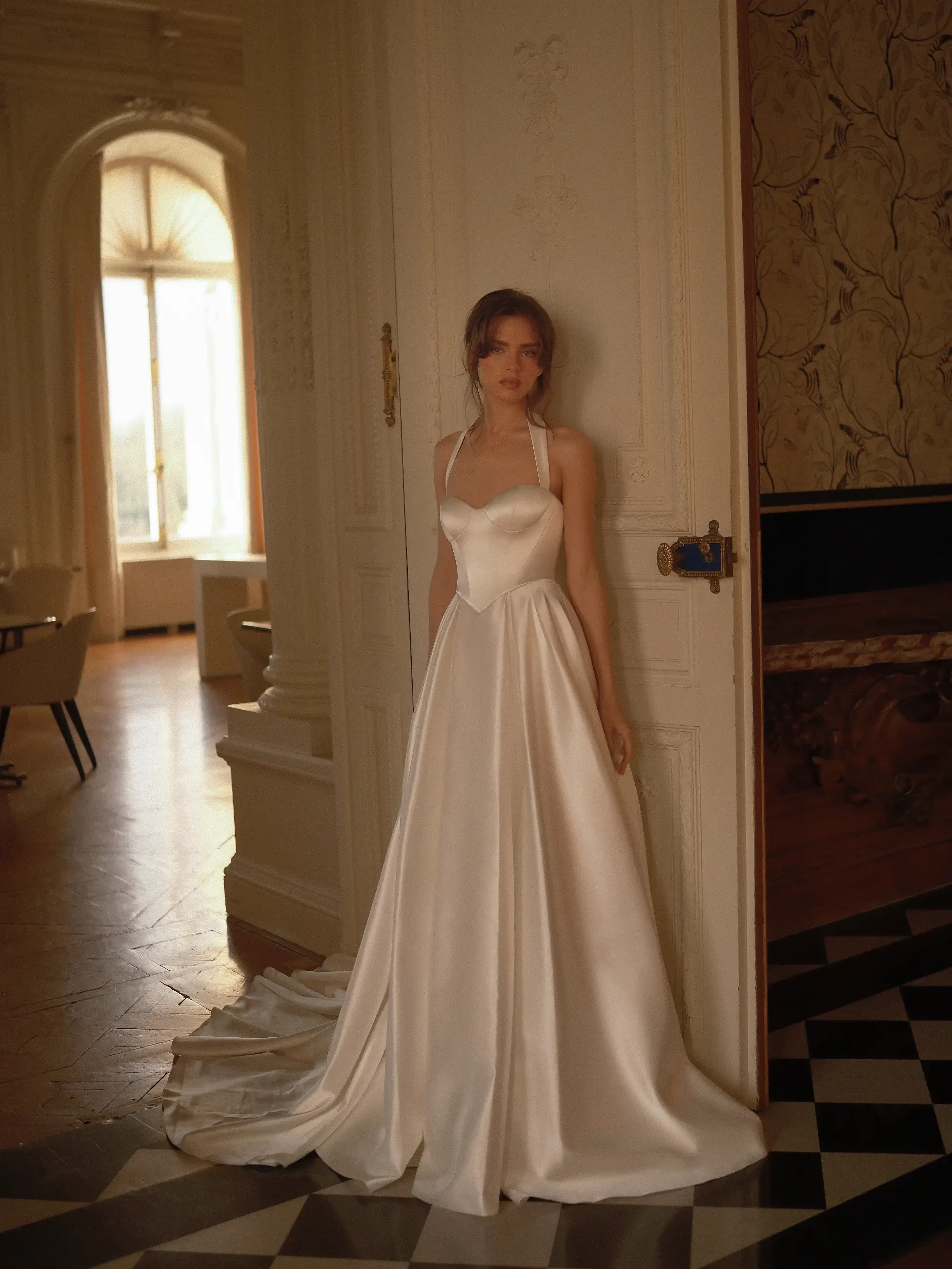 model is wearing a sleeveless a-line bridal gown