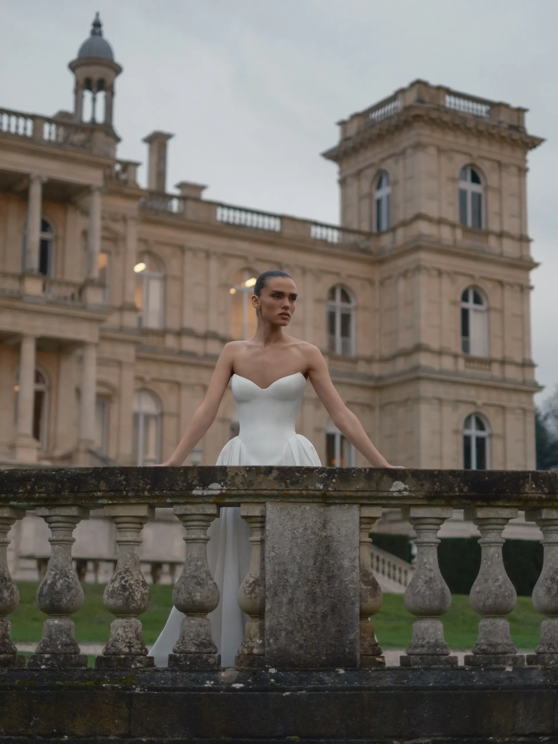 model is wearing a strapless daniel elbaz wedding gown