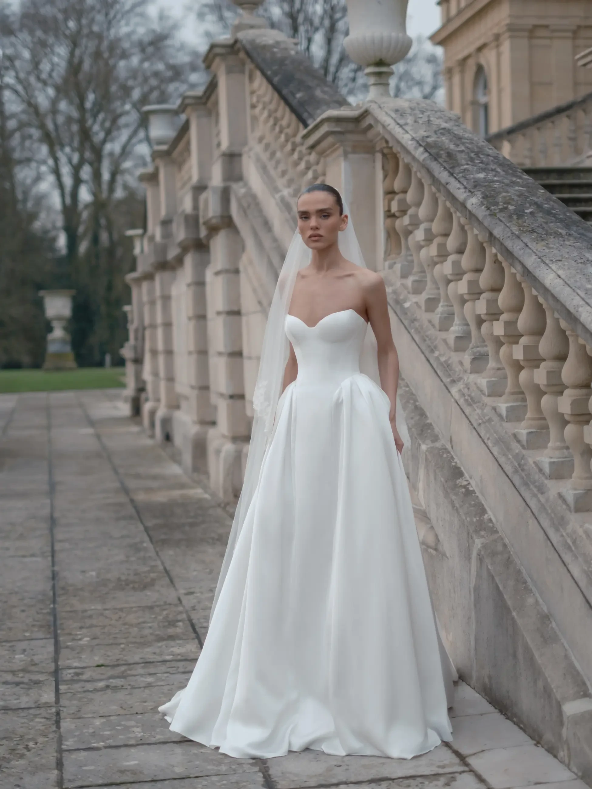 model is wearing a strapless bridal gown