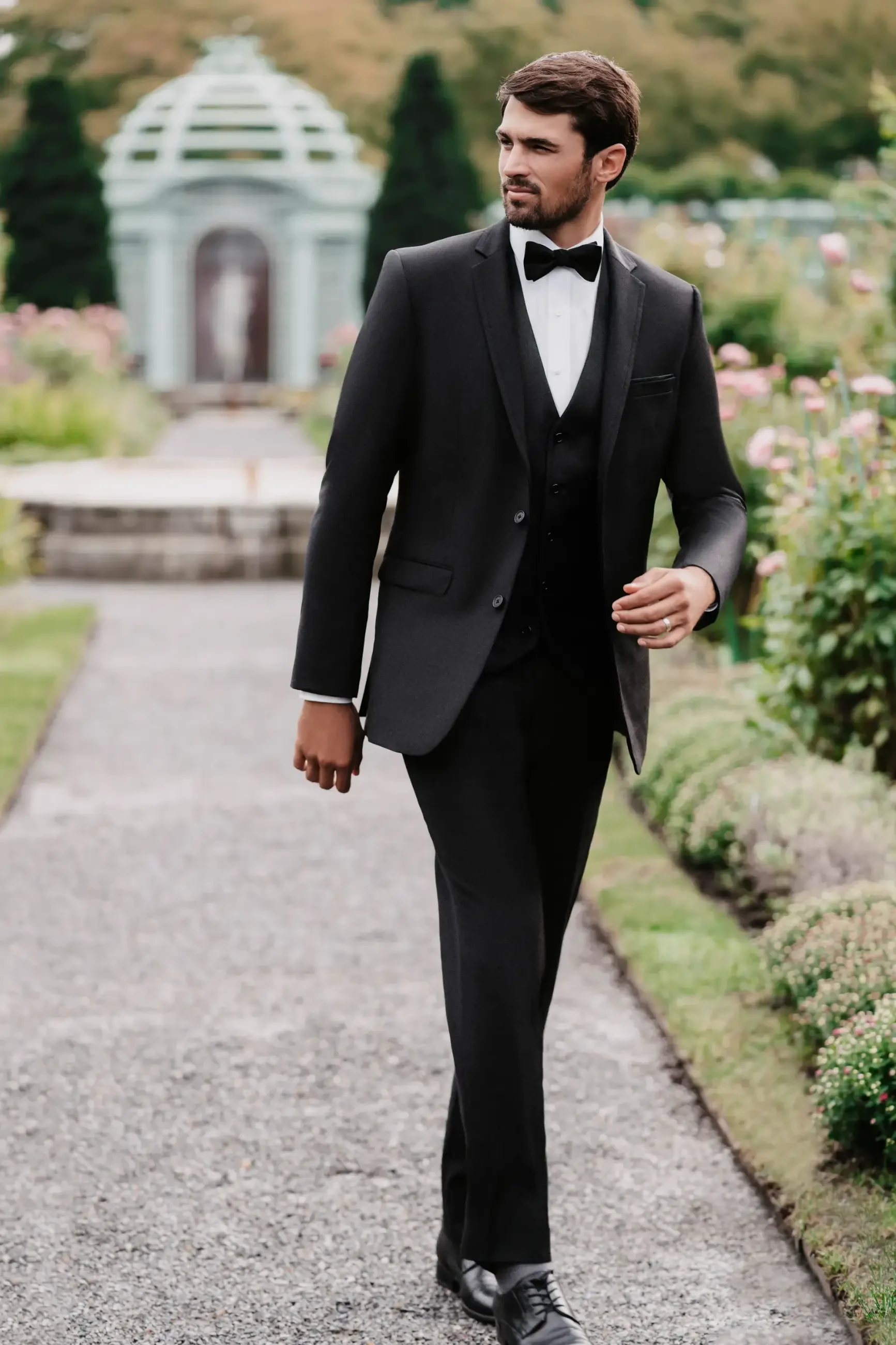 model is wearing a black tux